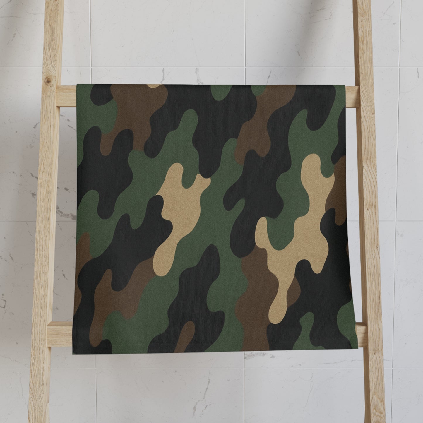 Military-style camo hand towel from Printify, ideal for bath decor, hunters, and campers. Durable fabric with camouflage pattern.