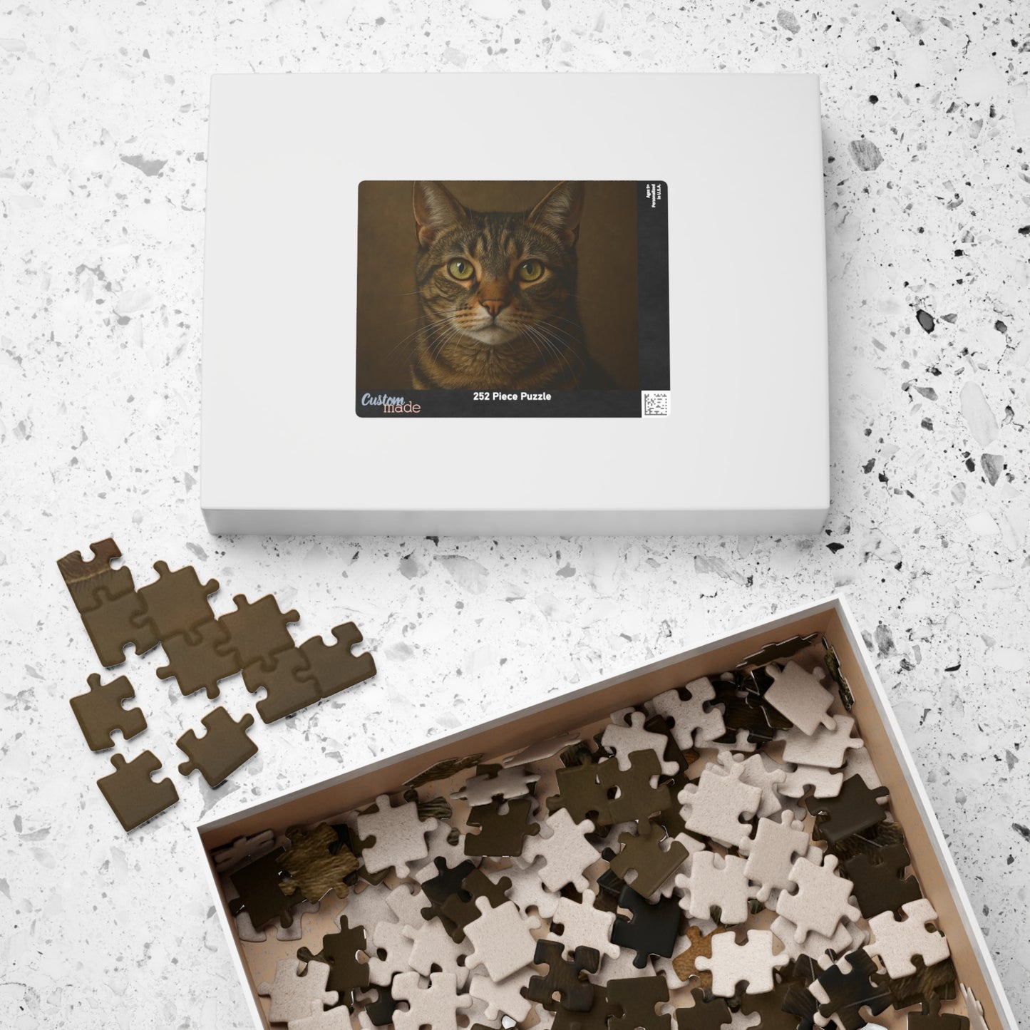 Realistic tabby cat portrait puzzle with 500 pieces, featuring detailed feline artwork suitable for jigsaw puzzle enthusiasts.