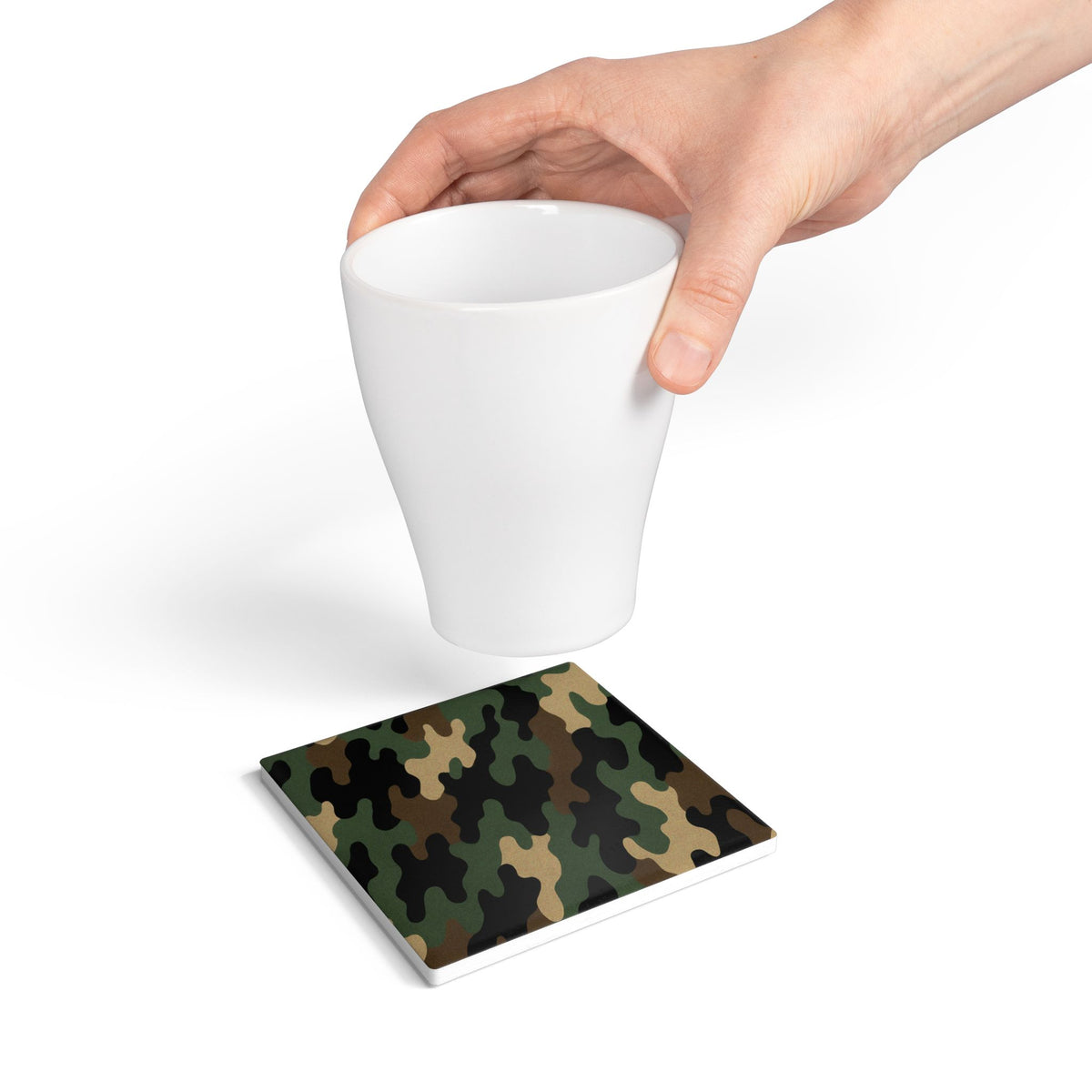 Green woodland camouflage ceramic coaster with Printify branding, designed as a durable drink protector for beverages.