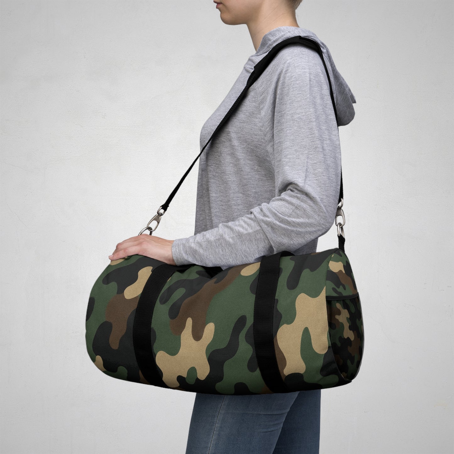 Military green camouflage duffel bag by Printify, versatile travel and gym bag with durable fabric and spacious interior.