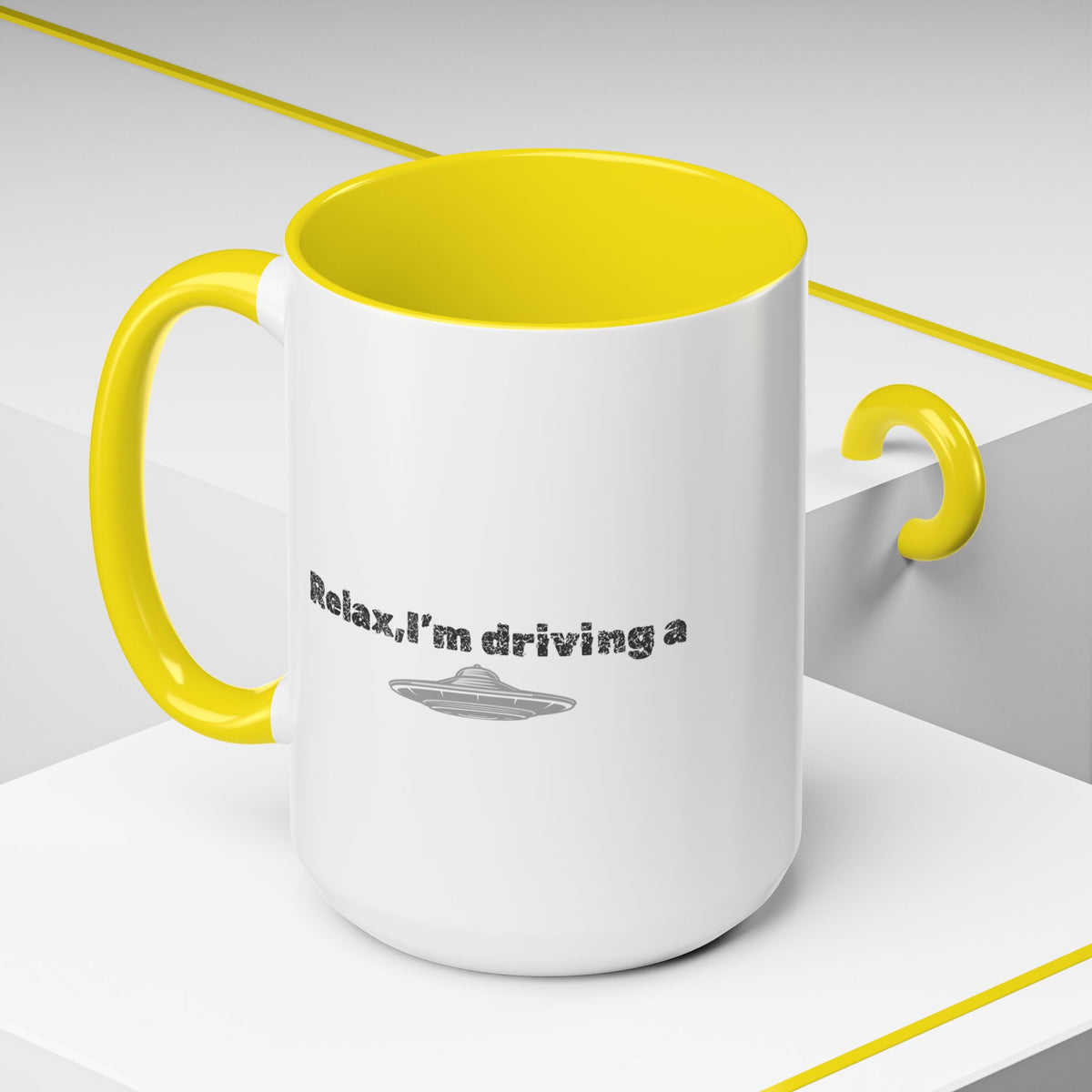 Ceramic coffee mug with "Relax, I’m Driving" UFO design, 11 oz, featuring a fun alien-themed print on white ceramic.