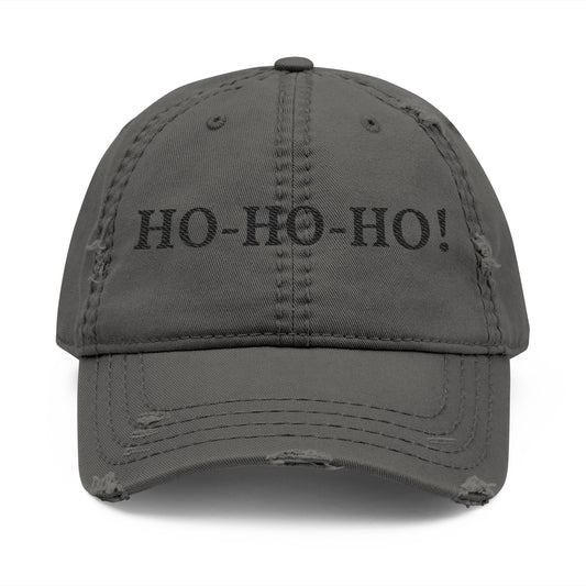 Distressed embroidered baseball hat with "HO-HO-HO" slogan, casual style, worn by a person, showing front view of the Printify hat.