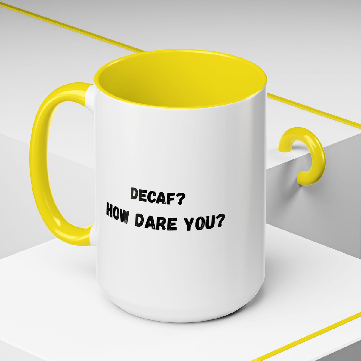 Ceramic coffee mug with "Decaf? How Dare You?" printed in black text, 11oz size, white background with a handle.