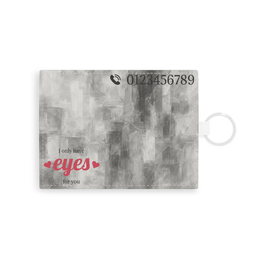 Abstract gray brushstroke saffiano leather card holder with minimalist design, compact accessory for cards and essentials.