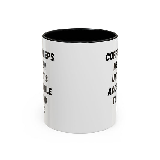 White ceramic coffee mug with black text reading "Coffee Keeps Me Busy Until It's Acceptable to Drink Wine" by Printify.