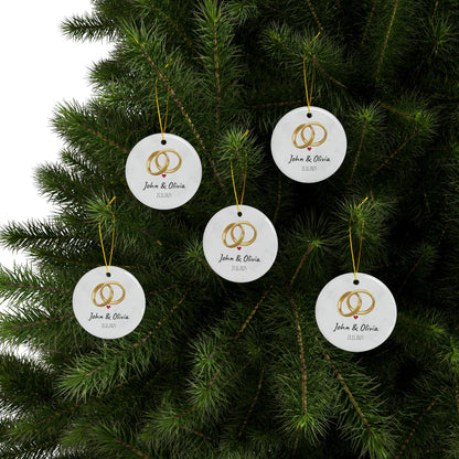 Round ceramic wedding rings ornament with personalized names and date, featuring floral design, by Printify.