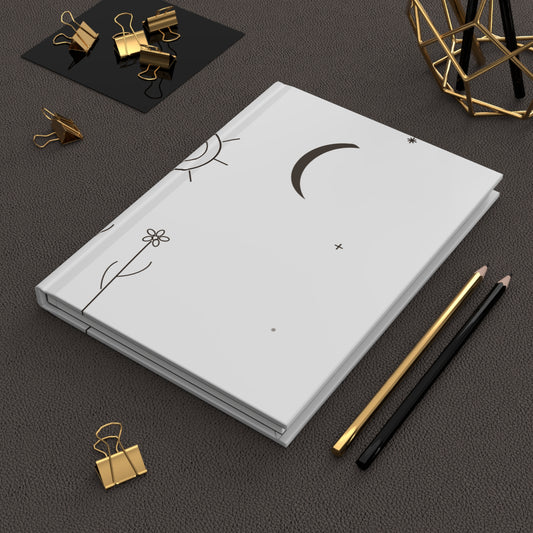 Hardcover journal with minimal moon and sun doodle design, matte finish, ideal for note-taking and journaling, by Printify.