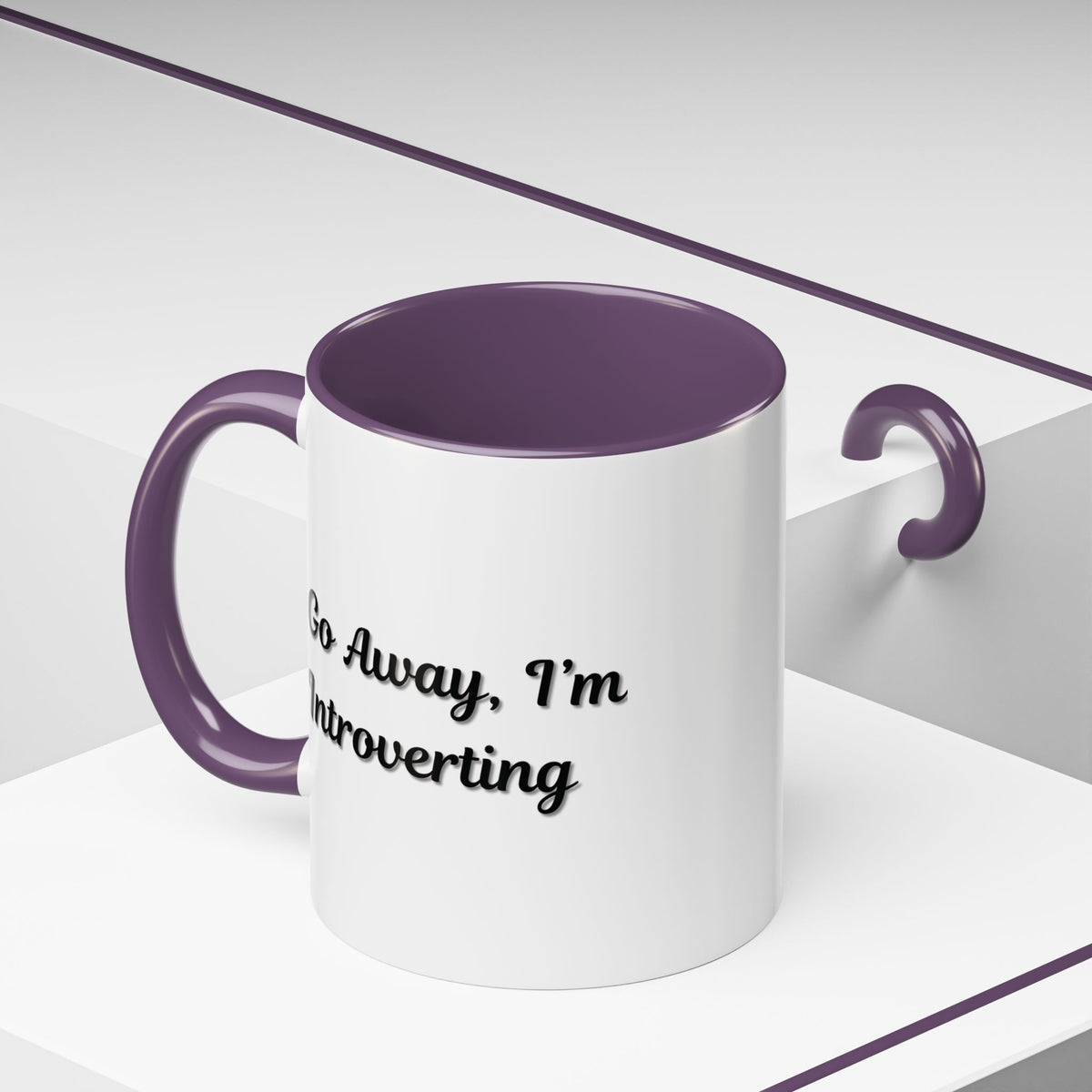Ceramic coffee mug with "Go Away, I'm Introverting" text, 11 oz size, from Printify, featuring a white background and black lettering.