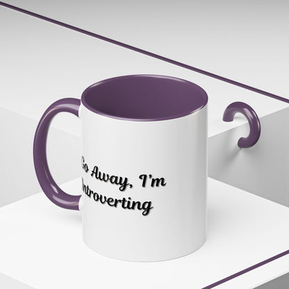 Ceramic coffee mug with "Go Away, I'm Introverting" text, 11 oz size, from Printify, featuring a white background and black lettering.