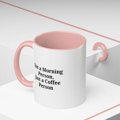 Ceramic coffee mug with "Not a Morning Person, Just a Coffee Person" printed in black on white background.