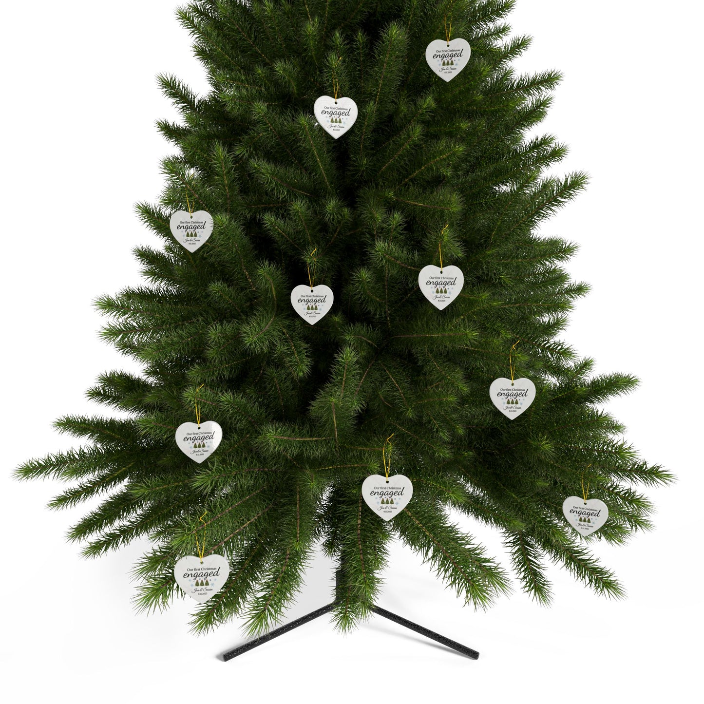 Ceramic "Our First Christmas Engaged" heart ornament with festive design, ideal for celebrating holiday engagement.