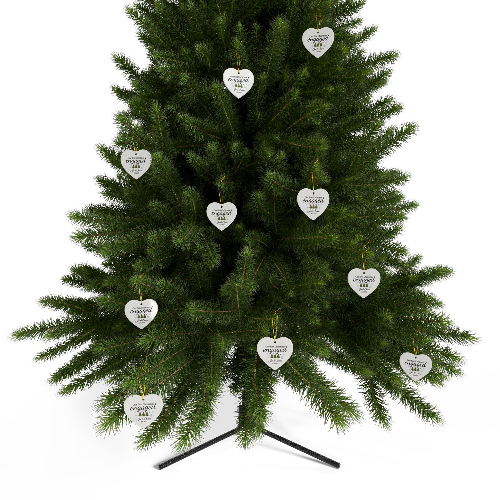 Ceramic "Our First Christmas Engaged" heart ornament with festive design, ideal for celebrating holiday engagement.
