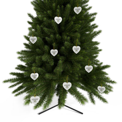Ceramic "Our First Christmas Engaged" heart ornament with festive design, ideal for celebrating holiday engagement.