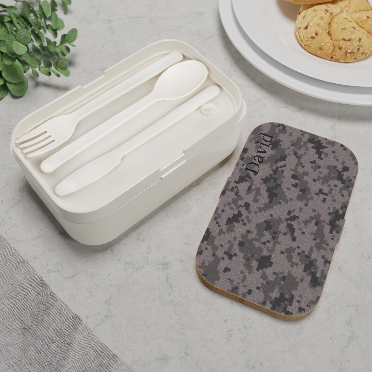 Personalized camouflage bento lunch box with optional custom name, durable accessories by Printify, ideal for kids and adults.