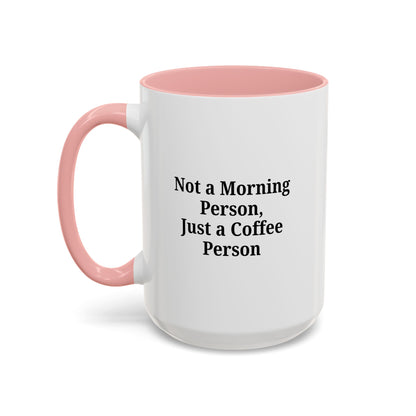 Ceramic coffee mug with "Not a Morning Person, Just a Coffee Person" print, ideal for morning beverages and coffee lovers.