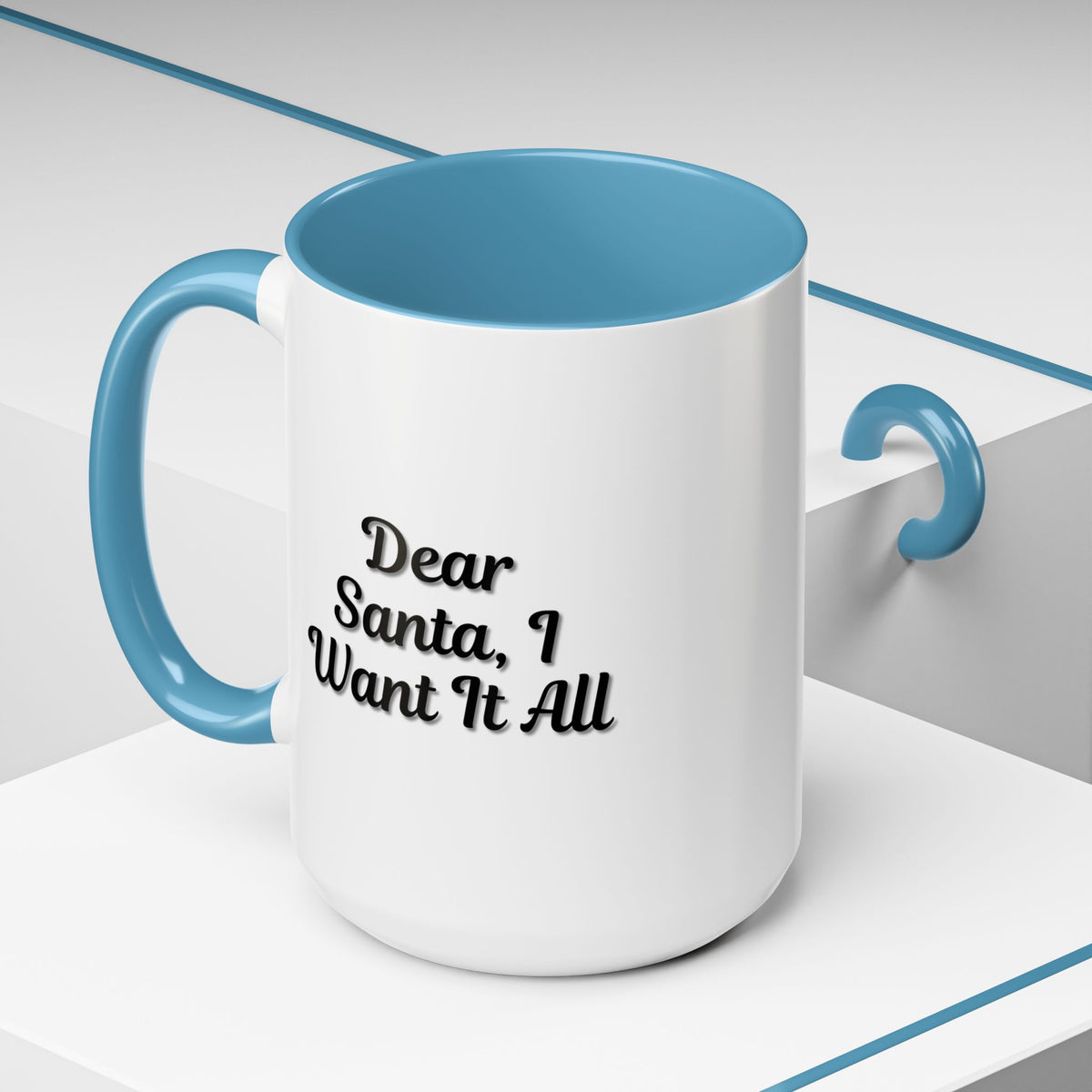 White ceramic coffee mug with "Dear Santa I Want It All" holiday Christmas message, perfect for festive gift-giving.