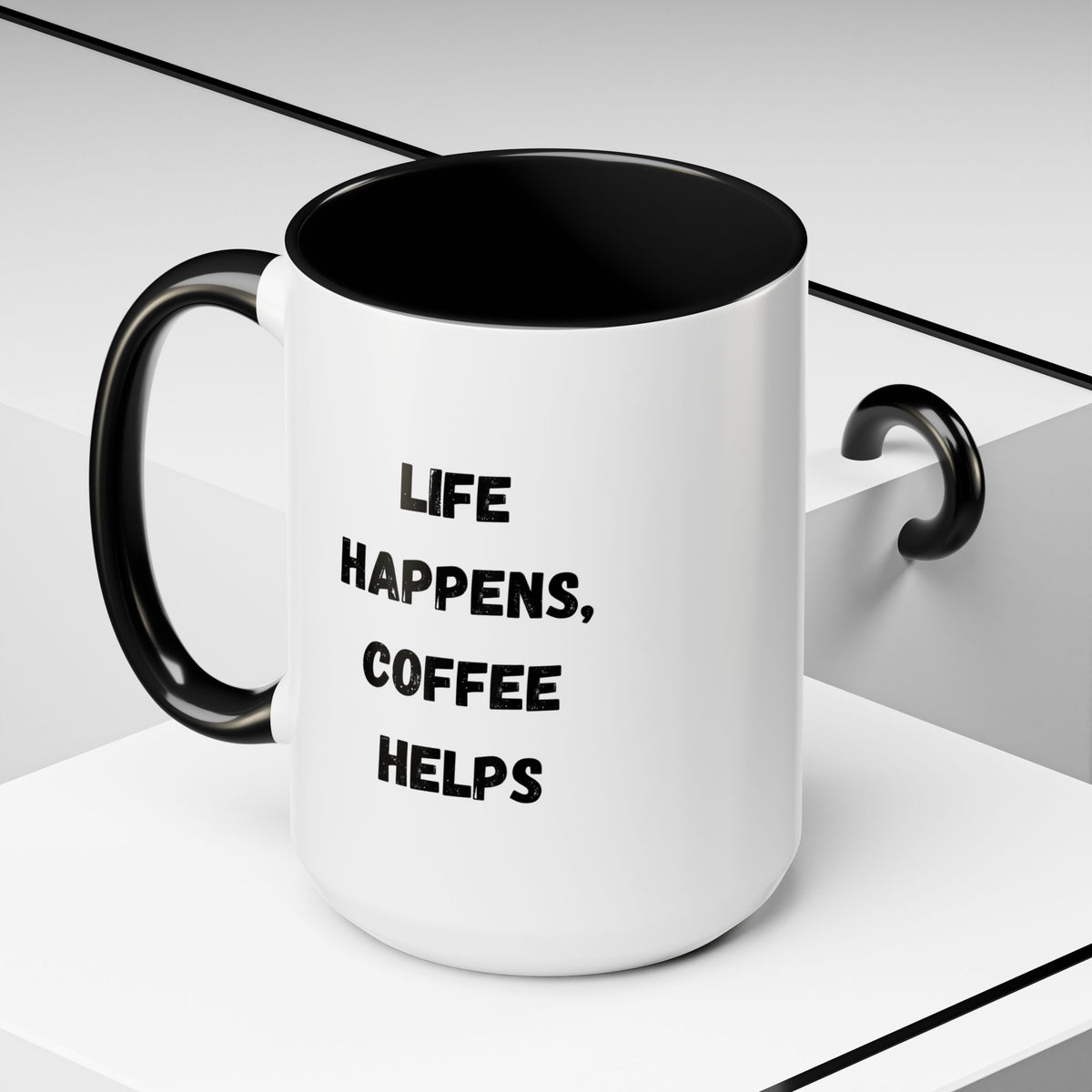 Black handle and rim coffee mug featuring "Life Happens, Coffee Helps" print, 11oz or 15oz capacity, by Printify.