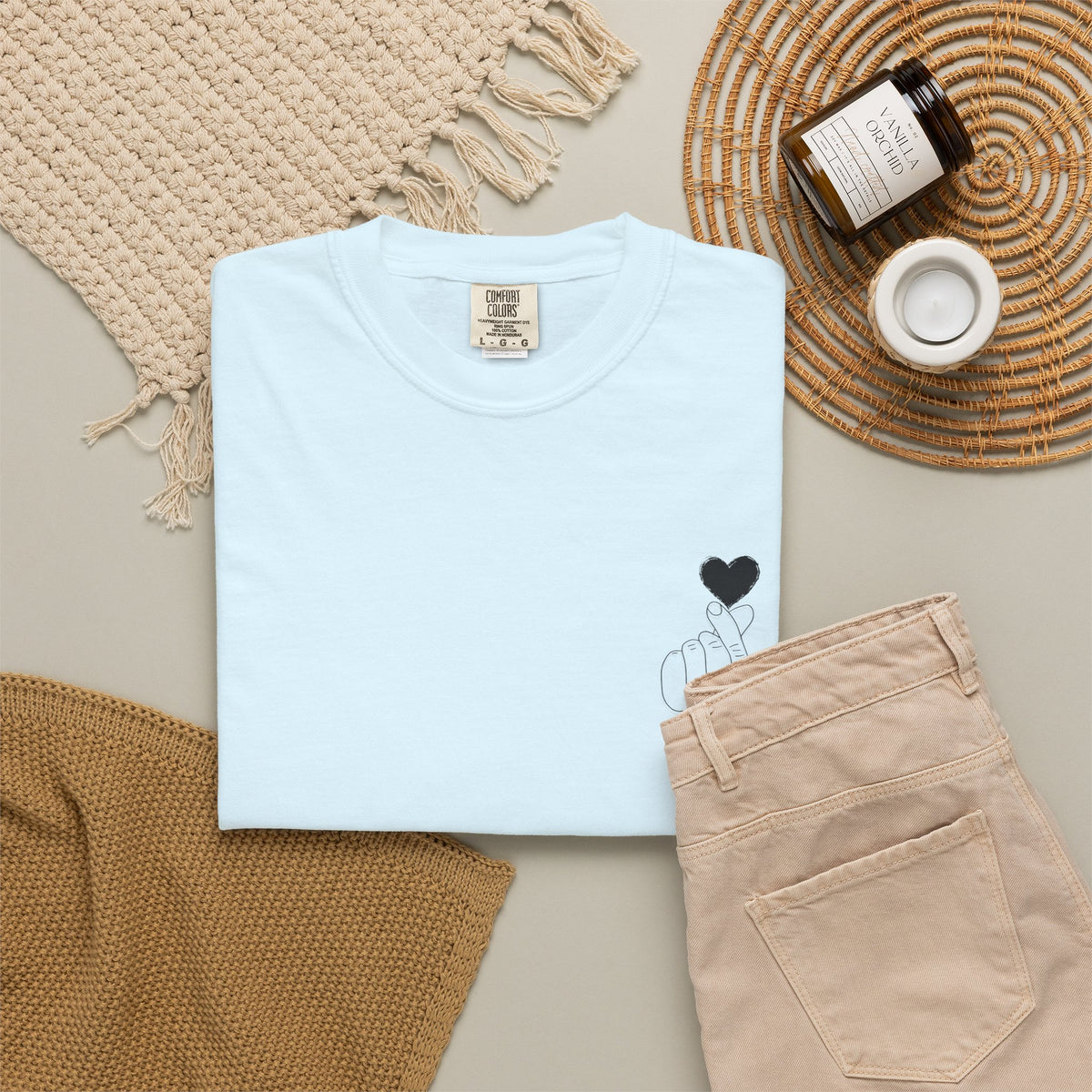 Black T-shirt with minimal white finger heart graphic, casual style, designed by Printify.