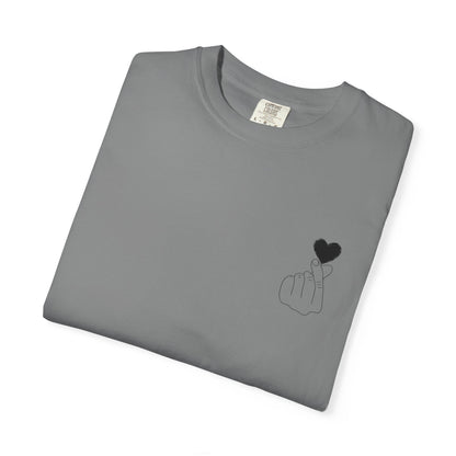 Black T-shirt by Printify featuring a minimal white finger heart graphic on the front.
