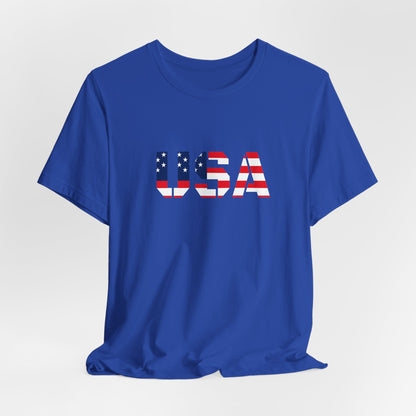 USA flag text T-shirt by Printify featuring patriotic red, white, and blue colors with a Fourth of July design on a casual tee.