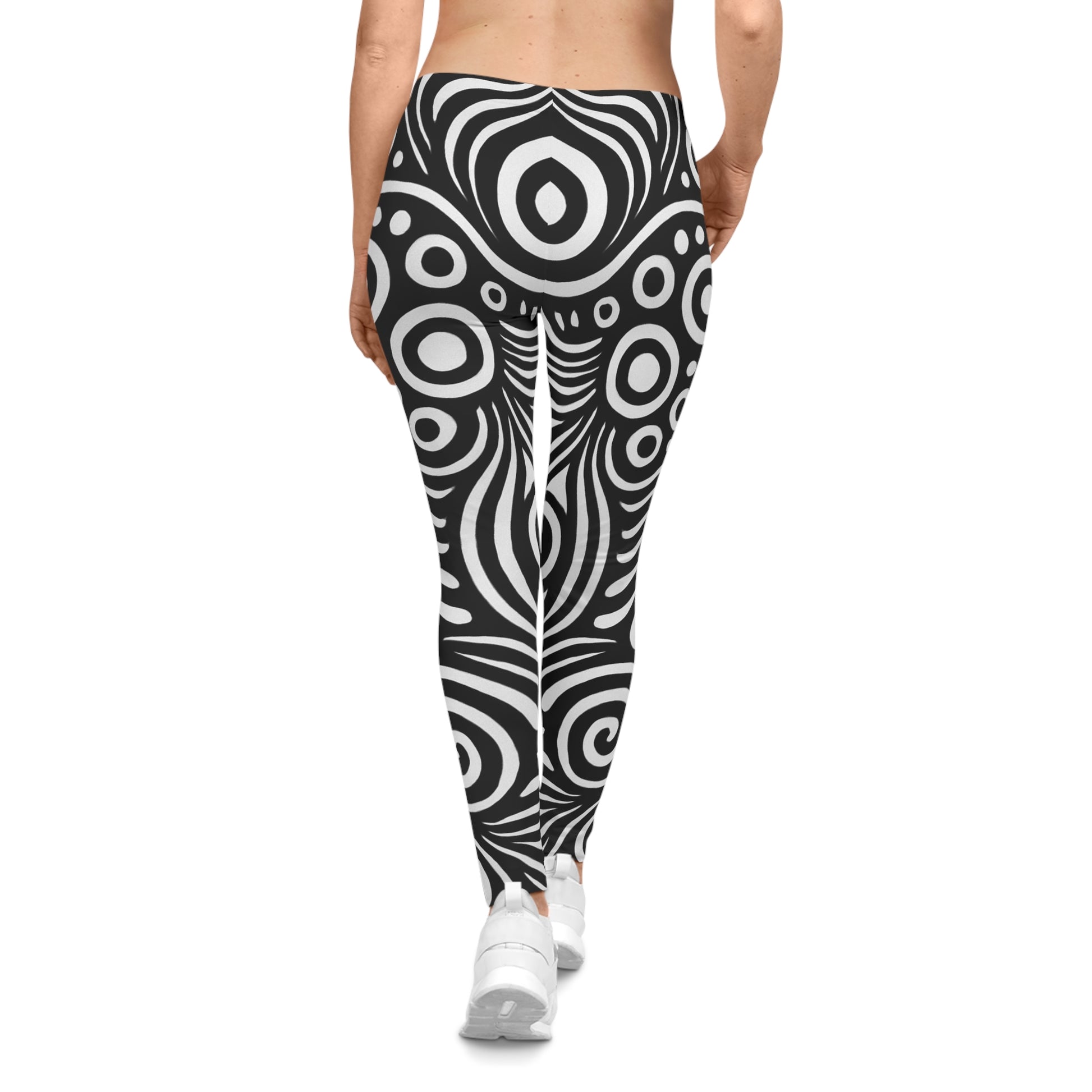Black and white swirl pattern leggings with retro psychedelic all-over print by Printify, showing vibrant, bold design on stretchy fabric.