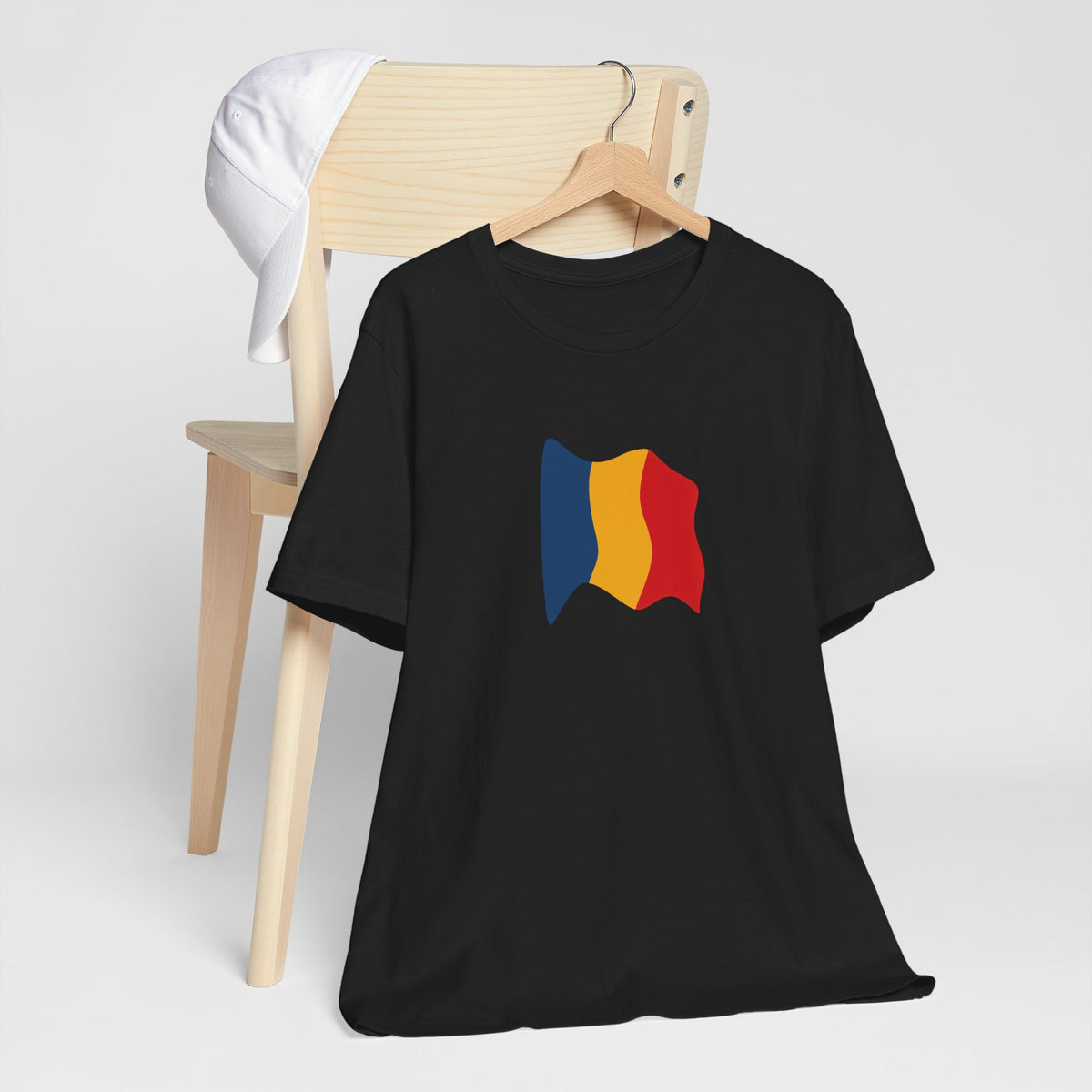Romania flag T-shirt by Printify featuring a minimal waving tricolor design on a casual cotton tee.