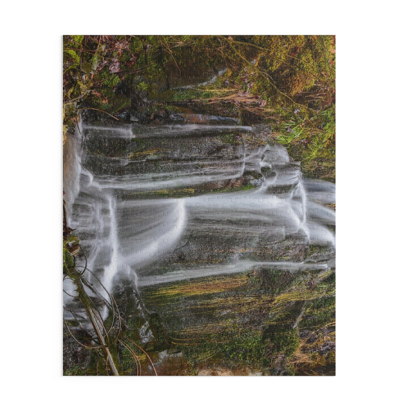 Colorful Mossy Waterfall Puzzle by Printify showing a scenic nature landscape with lush greenery and cascading water.