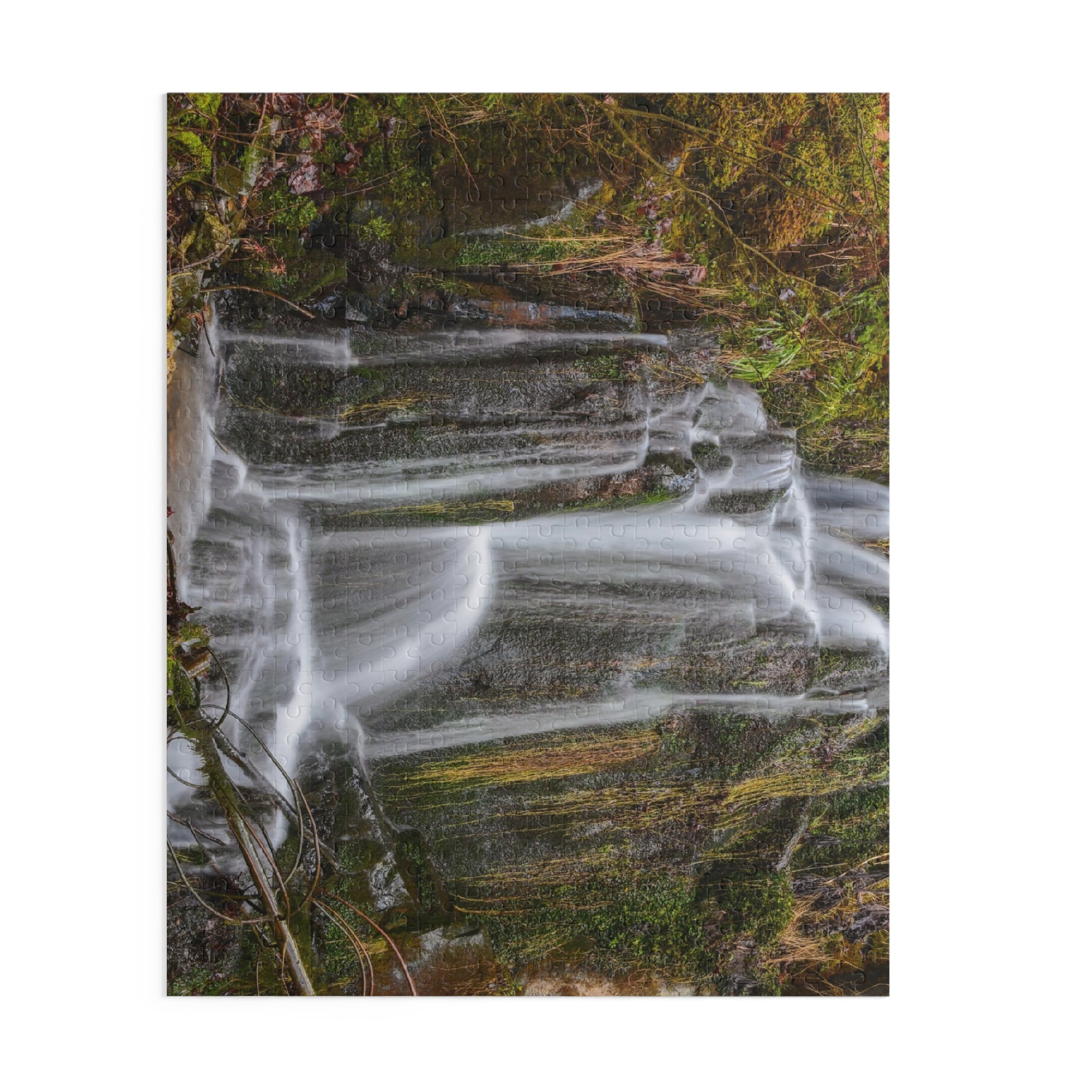 Colorful Mossy Waterfall Puzzle by Printify showing a scenic nature landscape with lush greenery and cascading water.