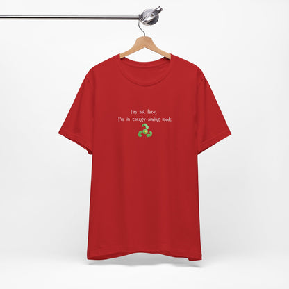 Eco-friendly mock T-shirt with humorous "I’m Not Lazy, I’m an Energy-Saving Mock" print, casual fit, Printify brand.