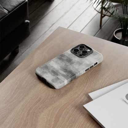 Abstract gray grid design phone case for iPhone, tough protective cover by Printify with modern geometric pattern.