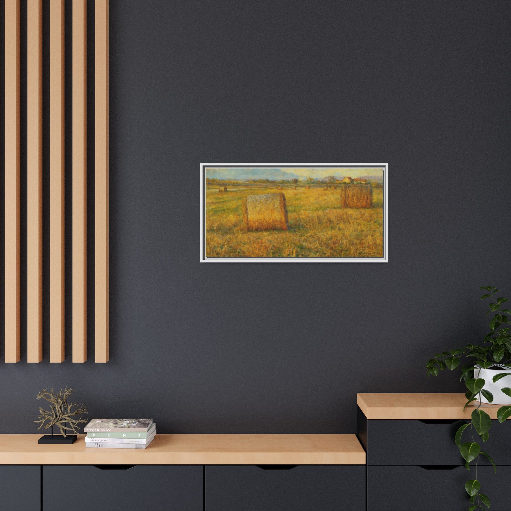 Framed matte canvas wall art featuring a rustic hayfield landscape print, showcasing natural colors and countryside scenery.