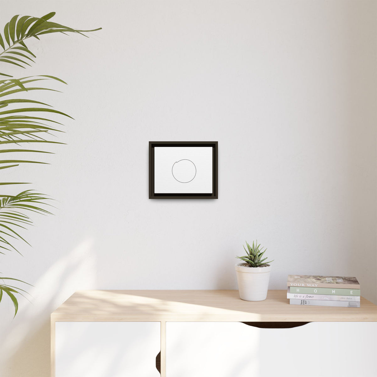 Framed matte canvas wall art featuring a minimal circular line design, ideal for modern home or office decor.