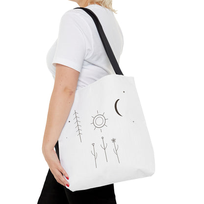 Minimal Moon and Sun botanical tote bag with celestial line art design, featuring nature-inspired motifs on durable fabric.