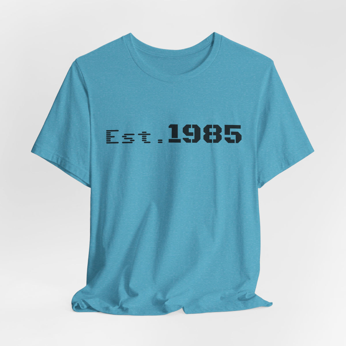 Gray vintage-style T-shirt with "Est. 1985" graphic and "Vintage Year" text, by Printify, showcasing the front design.