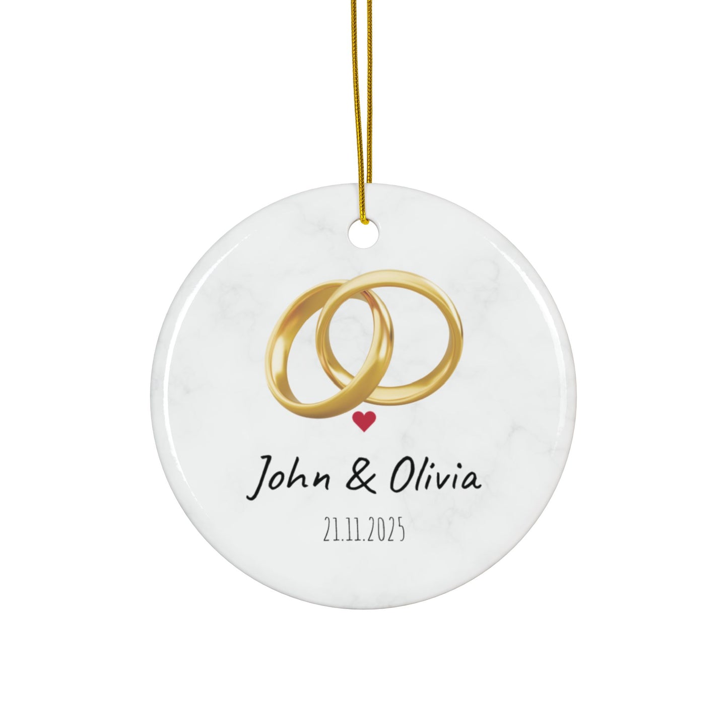 Round ceramic wedding rings ornament with personalized names and date, featuring decorative wedding ring design.