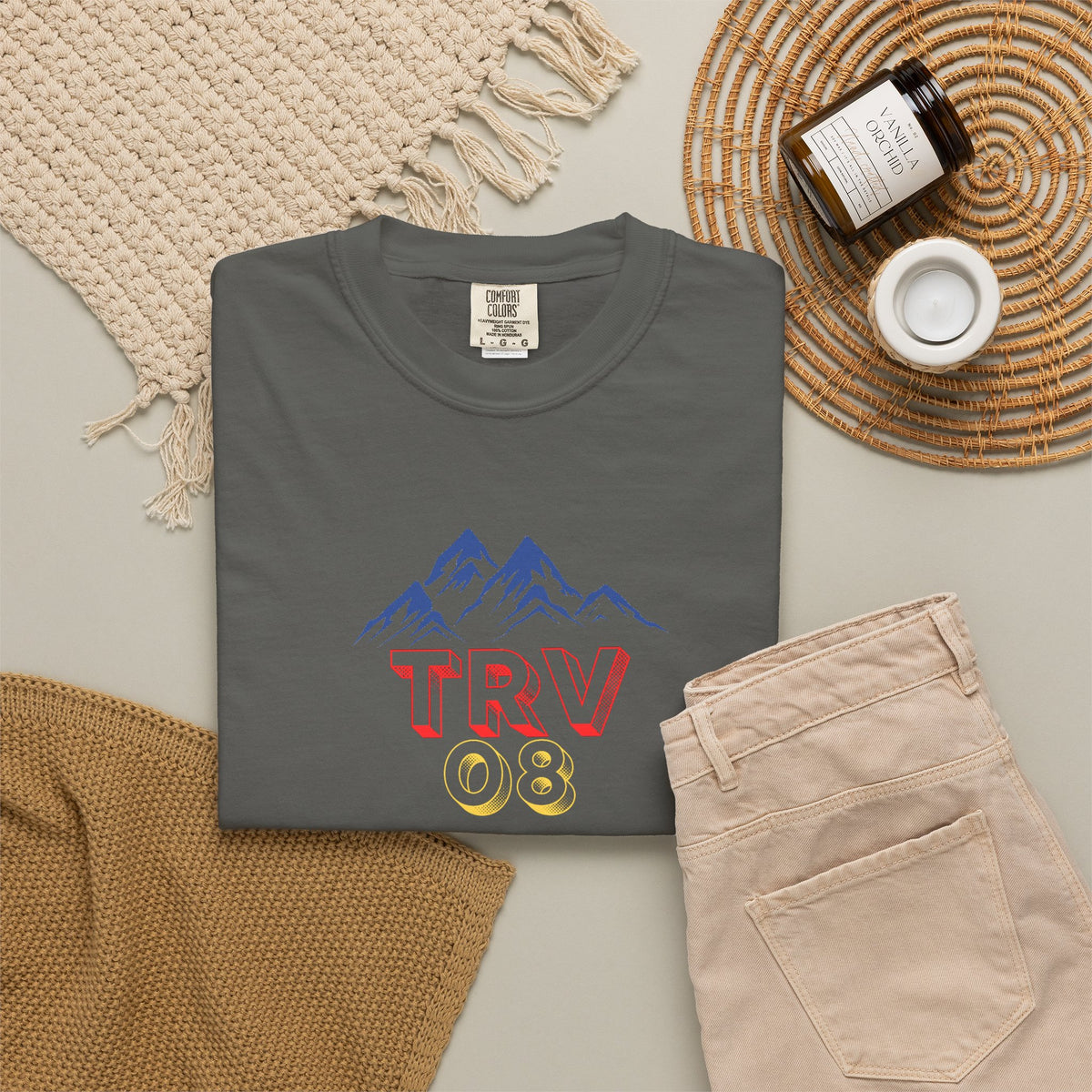 Unisex garment-dyed T-shirt with TRV08 Logo print, made by Printify, shown in natural fabric texture and relaxed fit.