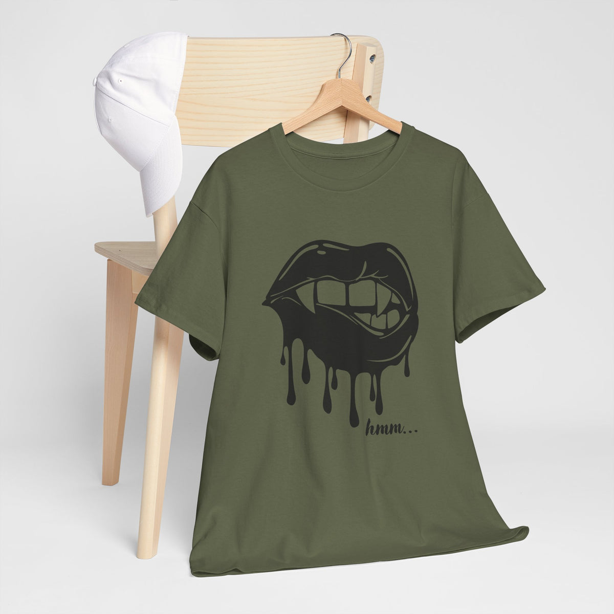 Graphic T-shirt featuring dripping lips and "hmm..." bite design in bold black and white print, casual streetwear style.