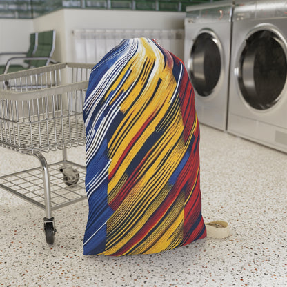 Colorful abstract brushstroke laundry bag in red, yellow, and blue, made by Printify, ideal for dorms and travel storage.