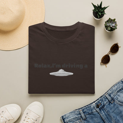 Funny alien graphic T-shirt by Printify featuring a UFO design, perfect for sci-fi fans and casual wear.