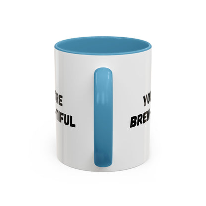 You’re Brew-tiful Coffee Mug – Cute Coffee Pun Accent Mug (11/15oz) — white ceramic accent mug with glossy finish and bold black “YOU’RE BREW-TIFUL” print, angled view