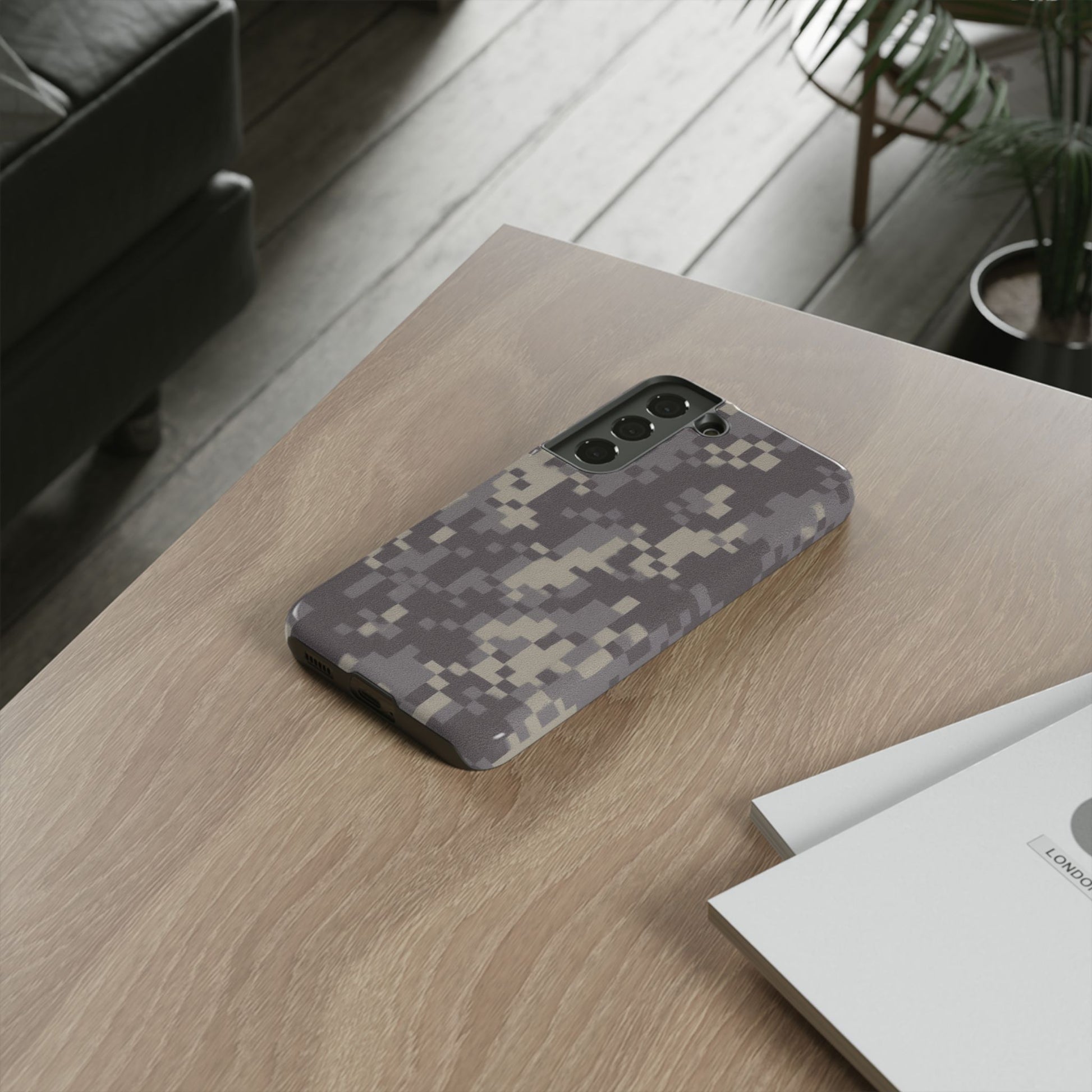Rugged digital camouflage Printify phone case protecting a smartphone with a tough, durable design and digital camo pattern.