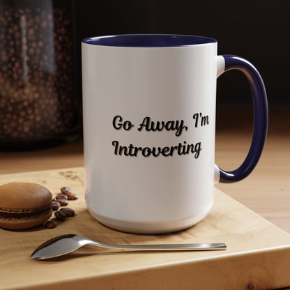 Ceramic coffee mug with "Go Away, I'm Introverting" slogan, 11 oz, perfect for introverts and coffee lovers.