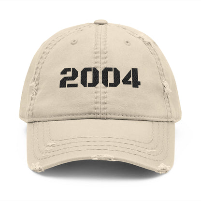 Vintage distressed 2004 dad hat with embroidered design, classic baseball cap style by Printify.
