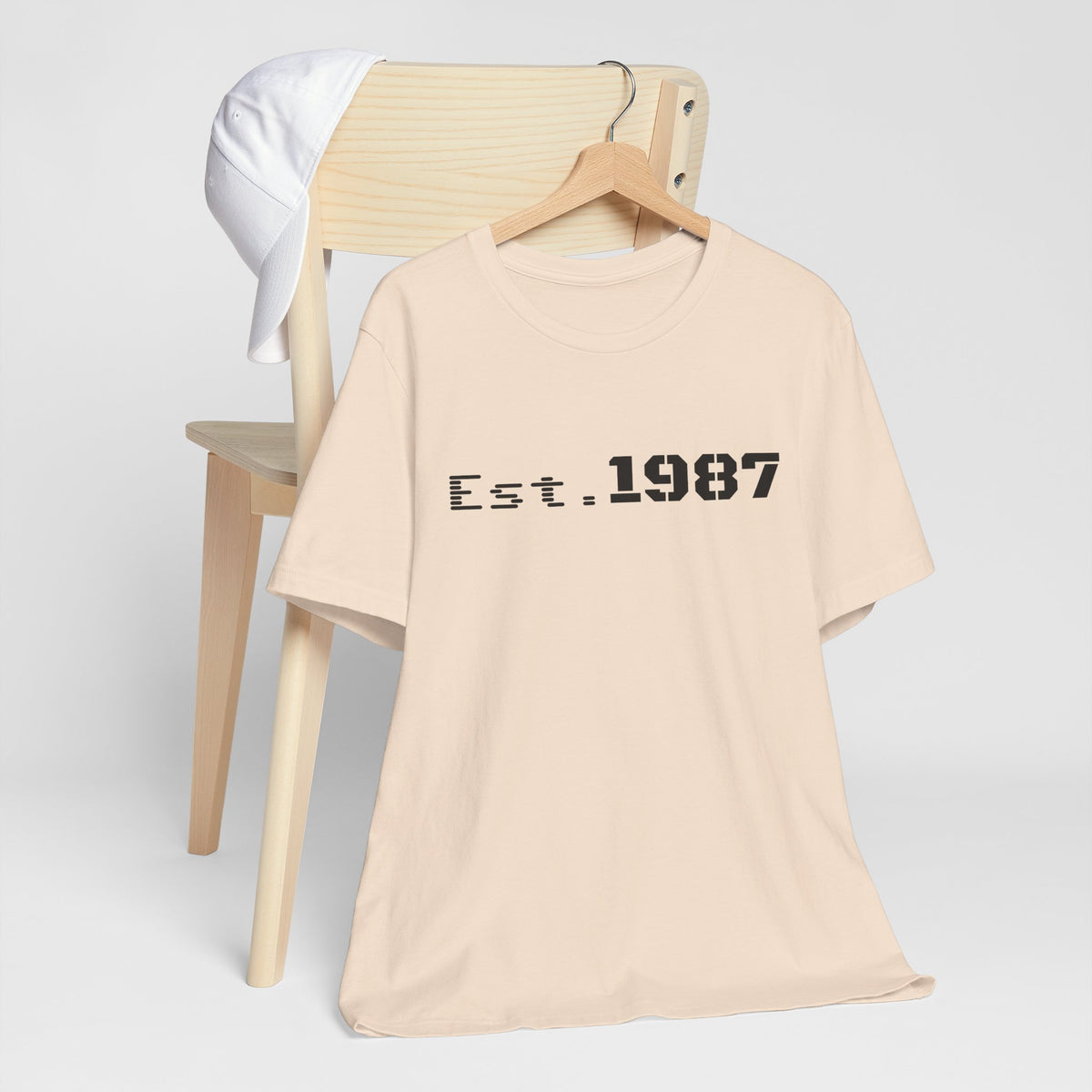 Vintage Est. 1987 T-Shirt by Printify featuring a classic design and comfortable cotton fabric, perfect for retro style.