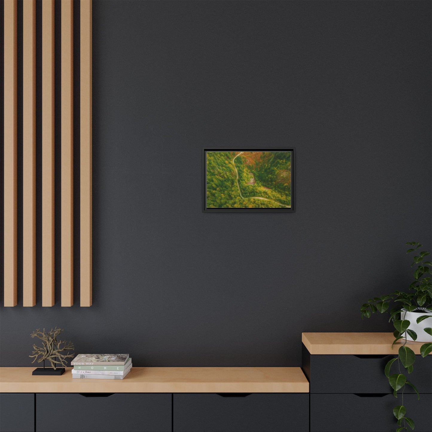 Colorful framed matte canvas wall art featuring an aerial view of a forest path landscape by Printify.