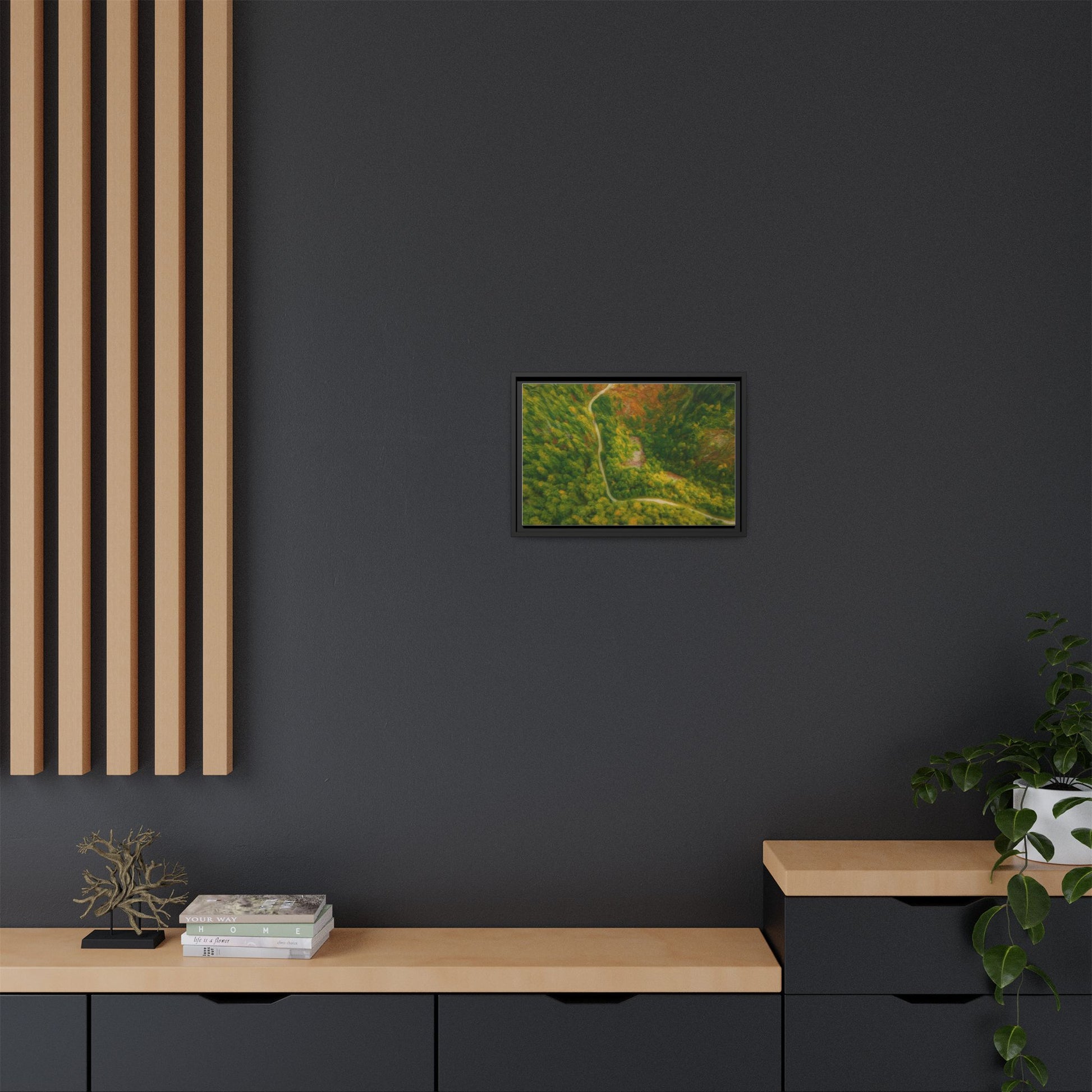 Colorful framed matte canvas wall art featuring an aerial view of a forest path landscape by Printify.