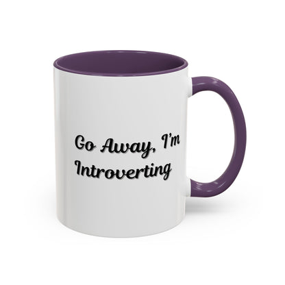 Ceramic coffee mug with "Go Away, I'm Introverting" text in black on white, 11 oz size, designed for introverts.