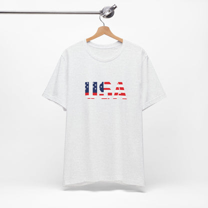 Red, white, and blue USA flag text T-shirt by Printify featuring patriotic Fourth of July design and casual fit.