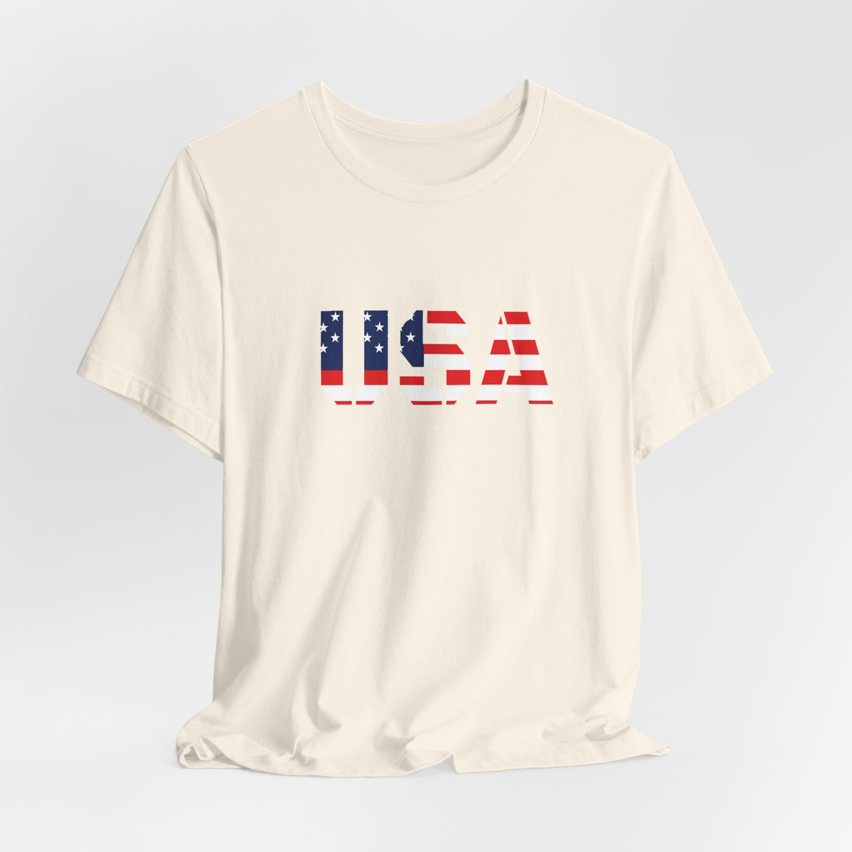 USA flag text T-shirt by Printify featuring patriotic Fourth of July design, casual cotton T-shirt with American flag graphics.