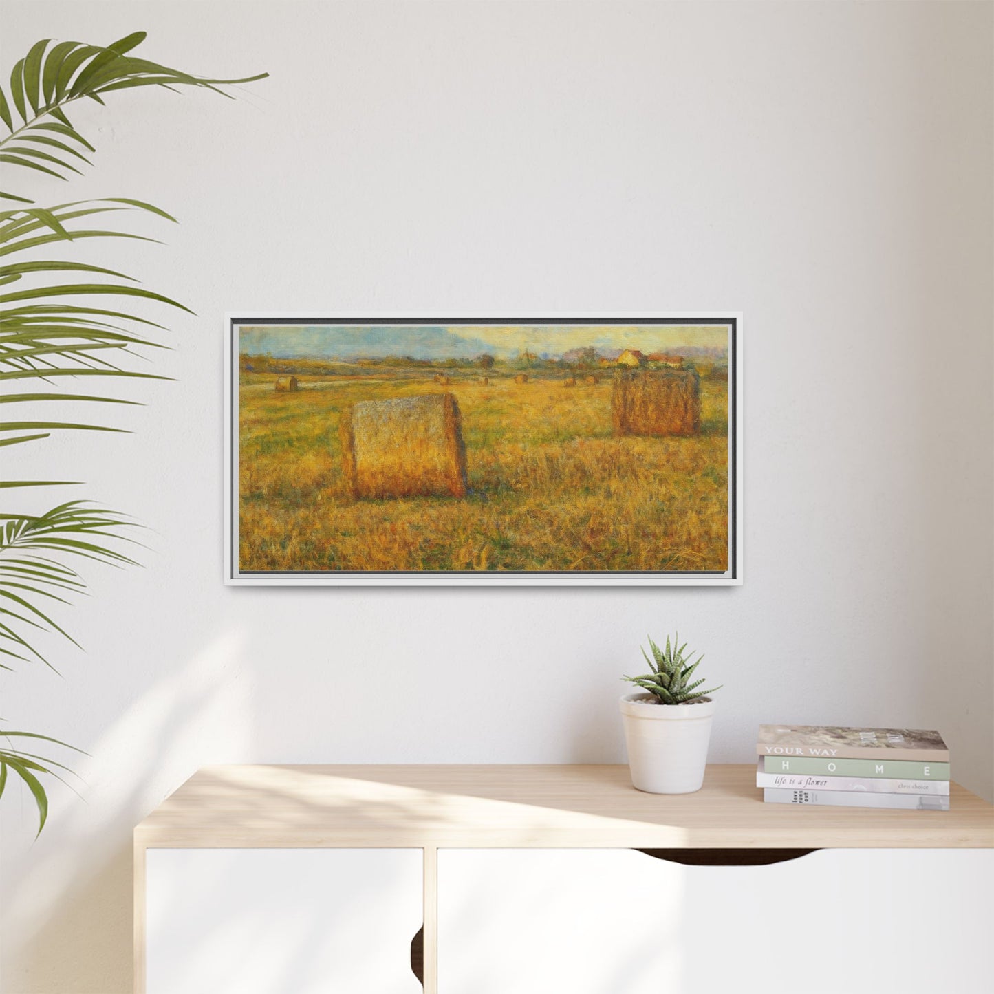 Framed matte canvas wall art featuring a rustic hayfield landscape print, showcasing vibrant colors and natural scenery.